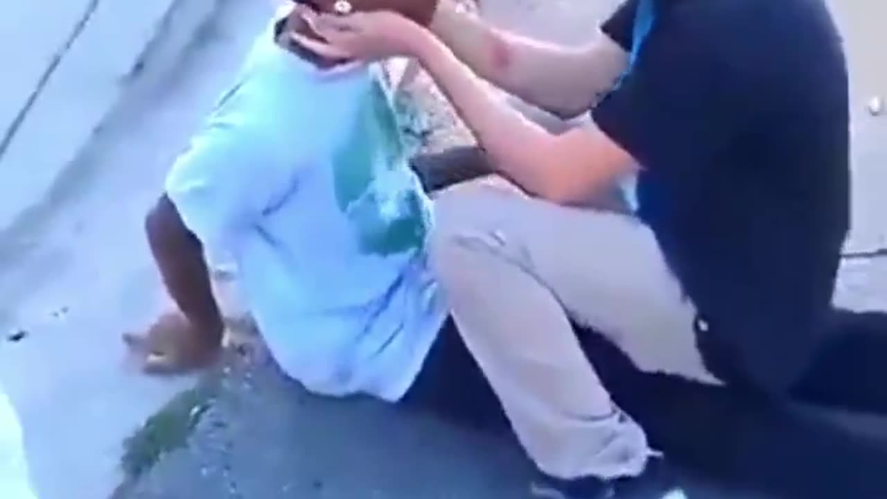 Bully gets knocked out in the street, people laugh and celebrate. Instant Karma