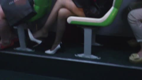 Lady dangling her high heels... 