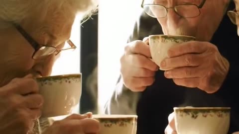 elderly people drinking tea happily in a nursing home