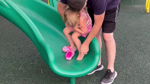 Daughter Falls Backward Off Slide Wall