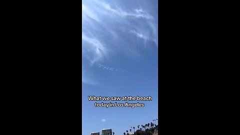 “THEY’RE LYING TO YOU” written out by airplanes in sky letters seen over Pacific