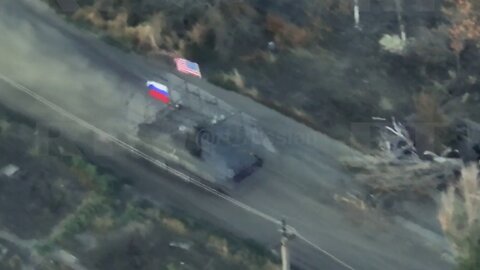 Russian Fighters Ride on Captured American Armored Personnel Carrier