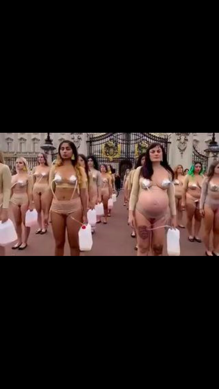 Women imitate cows in a protest against dairy cruelty in front of Buckingham Palace, London