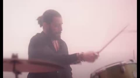 Jonathan Roumie appears in the video clip Arms around the Sun of Michael W Smith at drums