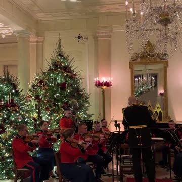 USMC Band plays as guests arrive to attend a concert by Andrea Bocelli