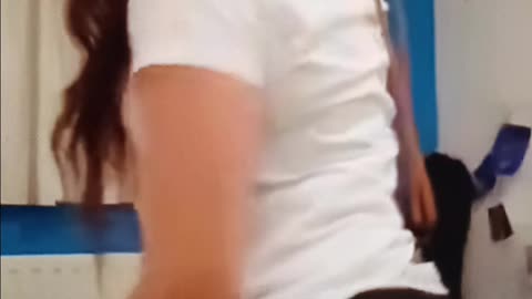 Girl gives herself a wedgie