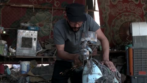 Iraqi mechanic Hussein Dawood transforms automobile scraps into artistic creations,