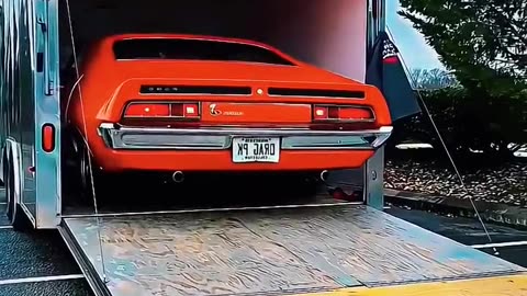 Catch the Thrill: Muscle Car Unload! Enclosed Car Shipping in Action