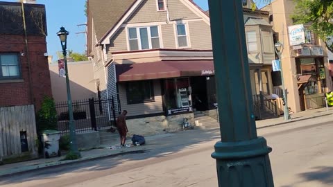Black In Boxers Crushes Cans In Middle Of Sidewalk