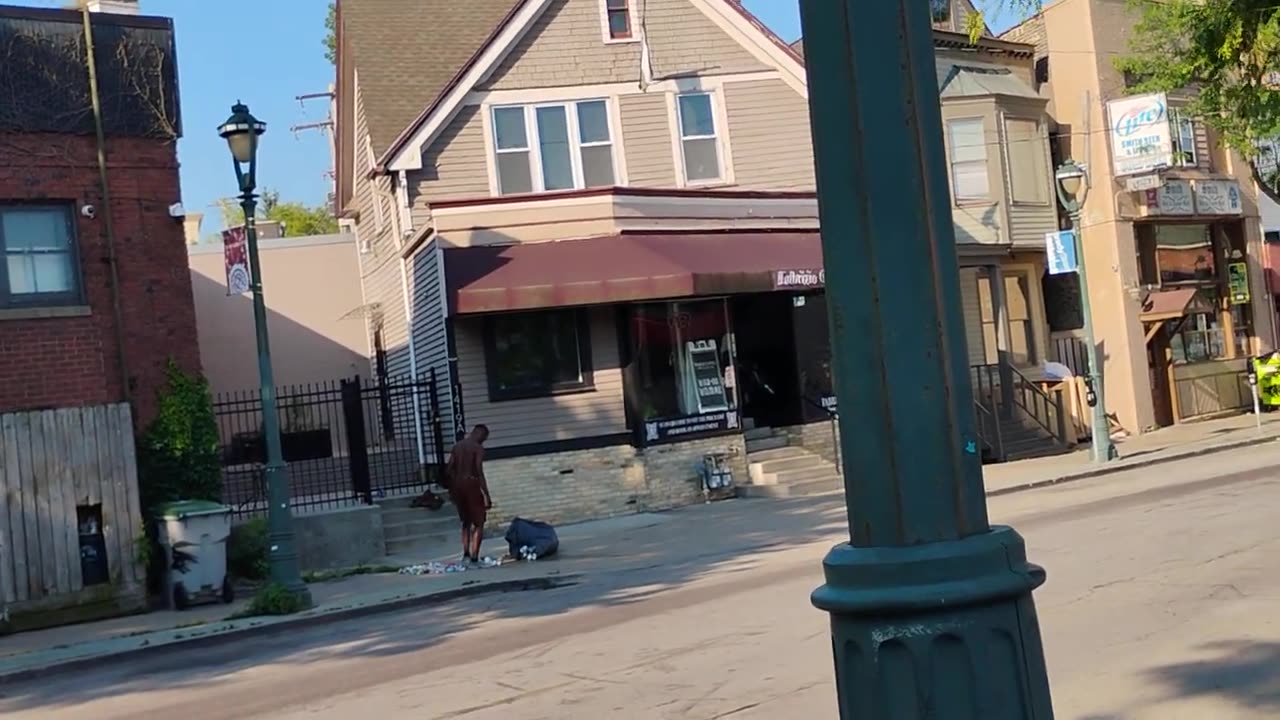 Black In Boxers Crushes Cans In Middle Of Sidewalk