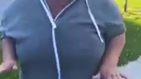 Racist woman hits young black woman
