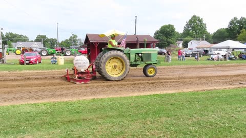 John Deer Tractor Pulls the pulling sled for the next tractor