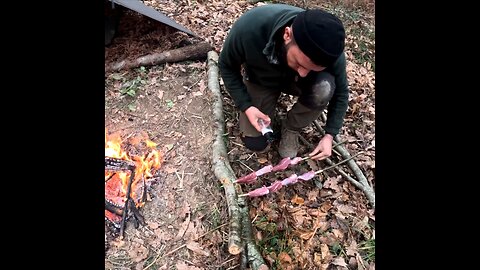 Bushcraft survival shelter camping and outdoor cooking in the wilderness