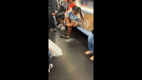 Joseph Martelli Niagara Falls ,NY Woman files her feet on NYC subway