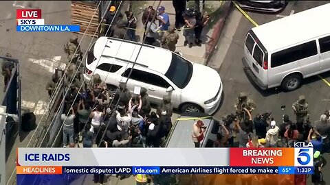Lunatic protester attempts to prevent ICE SUV from leaving scene of Raid...