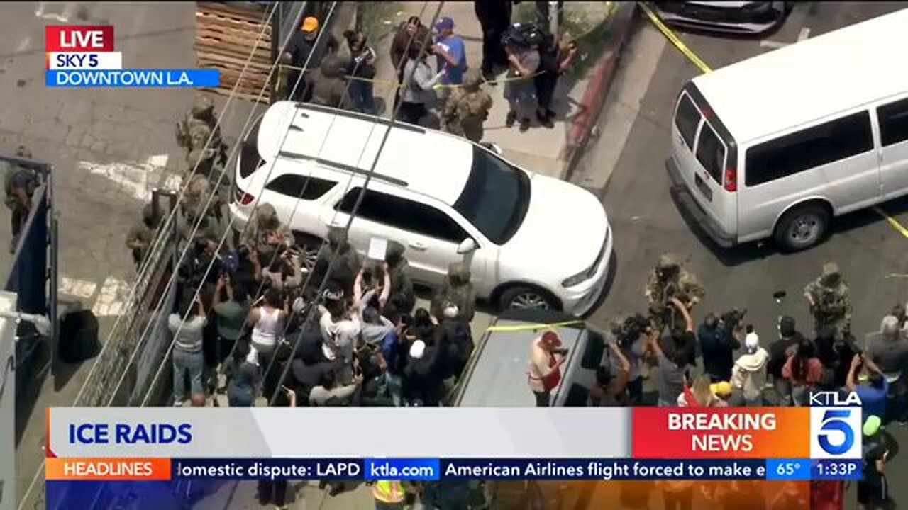 Lunatic protester attempts to prevent ICE SUV from leaving scene of Raid...