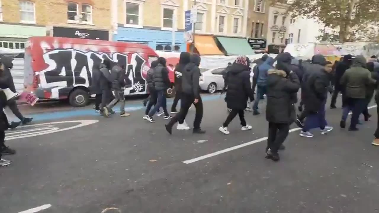 Muslims with weapons marching through London while the police are just standing watching!
