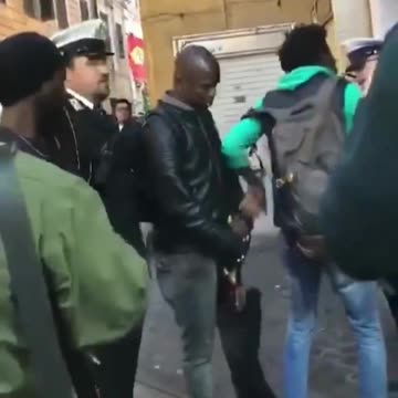 The local police in Rome carry out a check to seize the stolen goods, but are threatened