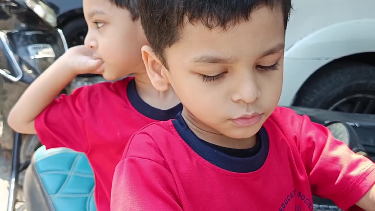 How about this caption: "Brothers on a roll—ready for their next adventure! 🛵"