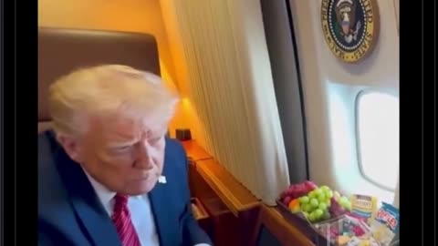President Trump looks out the window of Air Force One as it enters Qatari Airspace