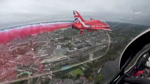 Over Windsor Castle - the Red Arrows provide a flypast to mark the State Visit