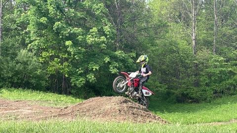 Watching my son jump his dirt bike