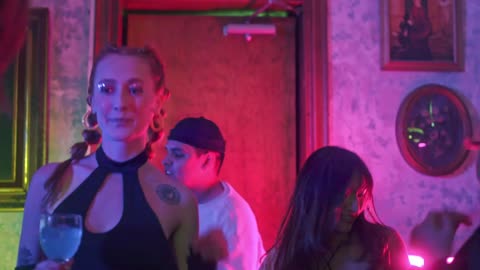 A group of friends dancing at a party.