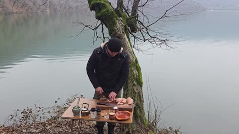 Cooking Chicken Kiev by the Lake in Nature