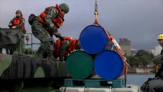 Taiwan sets explosives at river mouth as China drills approach