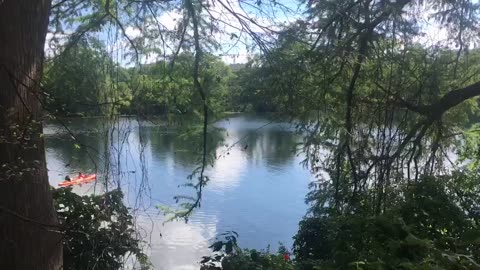 They are boating in the lake, Have a nice day.