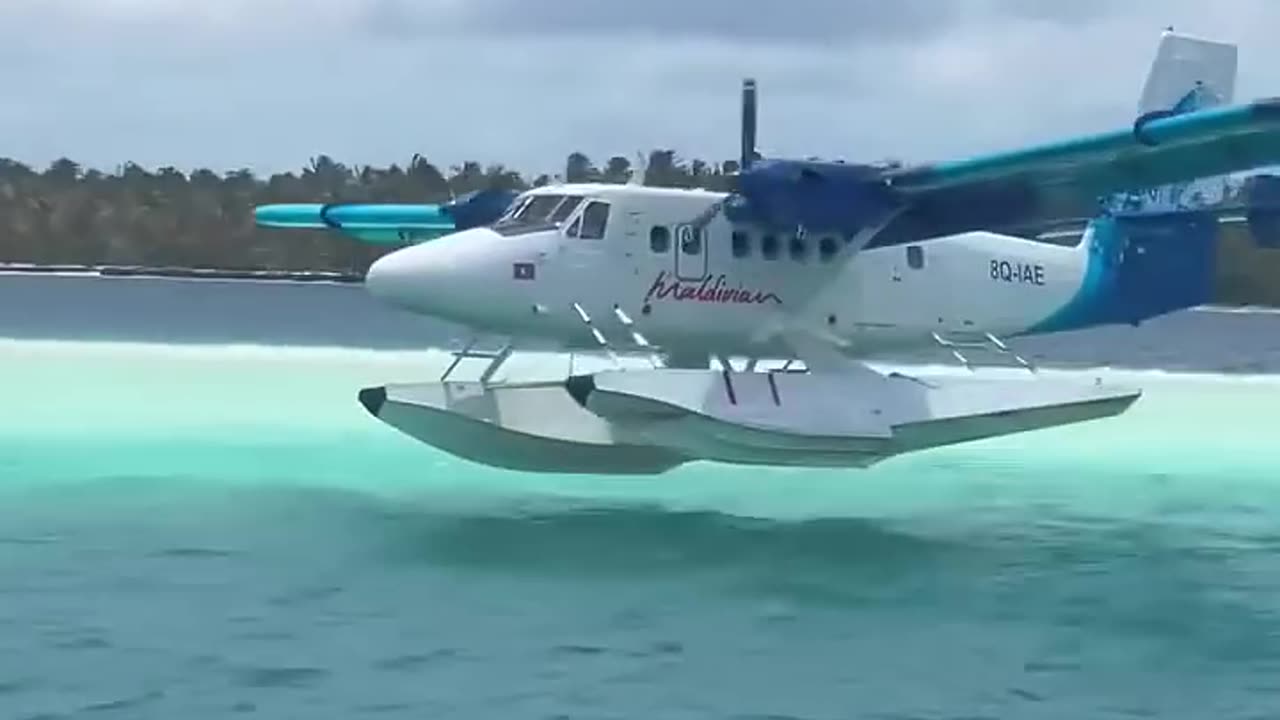 Seaplane landing water Maldives