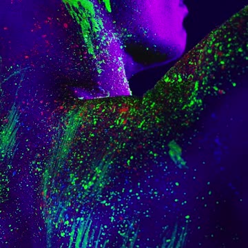 Abstract image of a man stained with phosphorescent paint