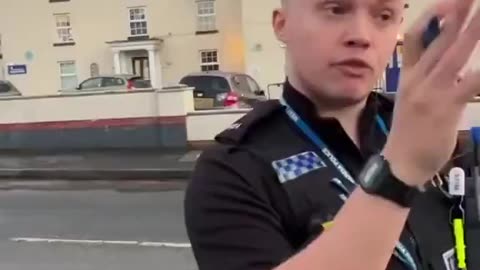 British police want to arrest a man for terrorism because some cars passed while he was filming