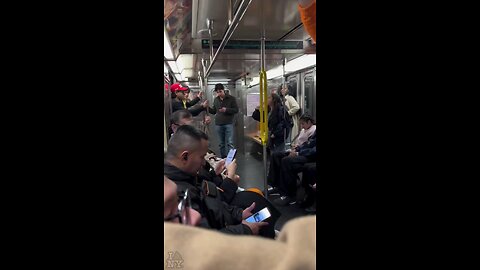 A woman on the subway attempts to remove a MAGA hat from a man and instantly faces karma