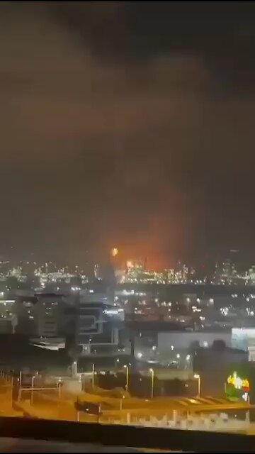 Fire and smoke seen rising from the Haifa Oil Refinery in Northern Israel after ballistic missiles