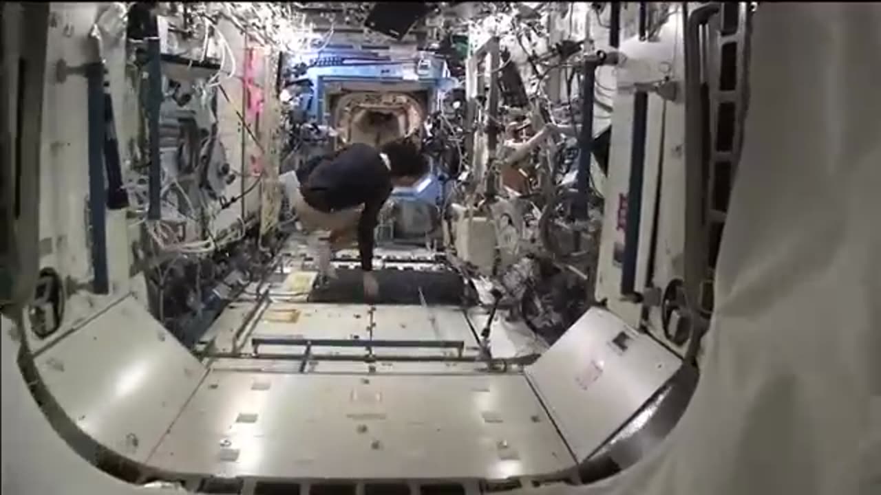 Departing space station commandor provide tour of orbital laboratory