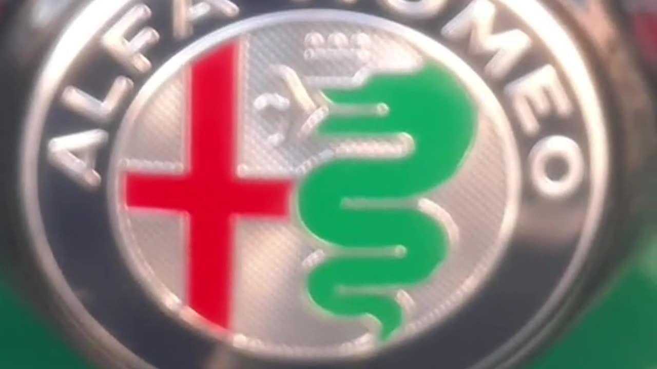 ALFA ROMEO DOG SERPENT EATING A MAN AND THE GEORGE GENOA GENOCIDE FLAG TRUTH IN PLAIN SIGHT