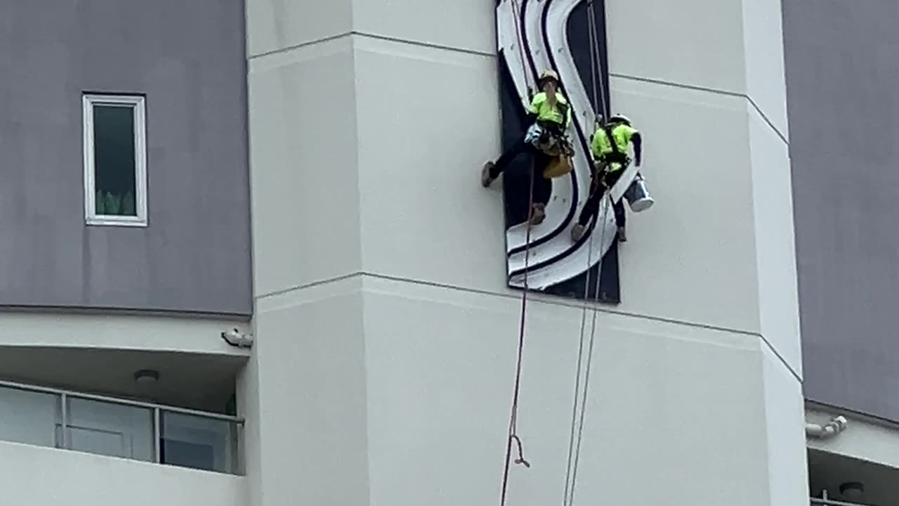 Rope Access Techs Descend Towering Sentinel Building for High-Altitude Sign Maintenance