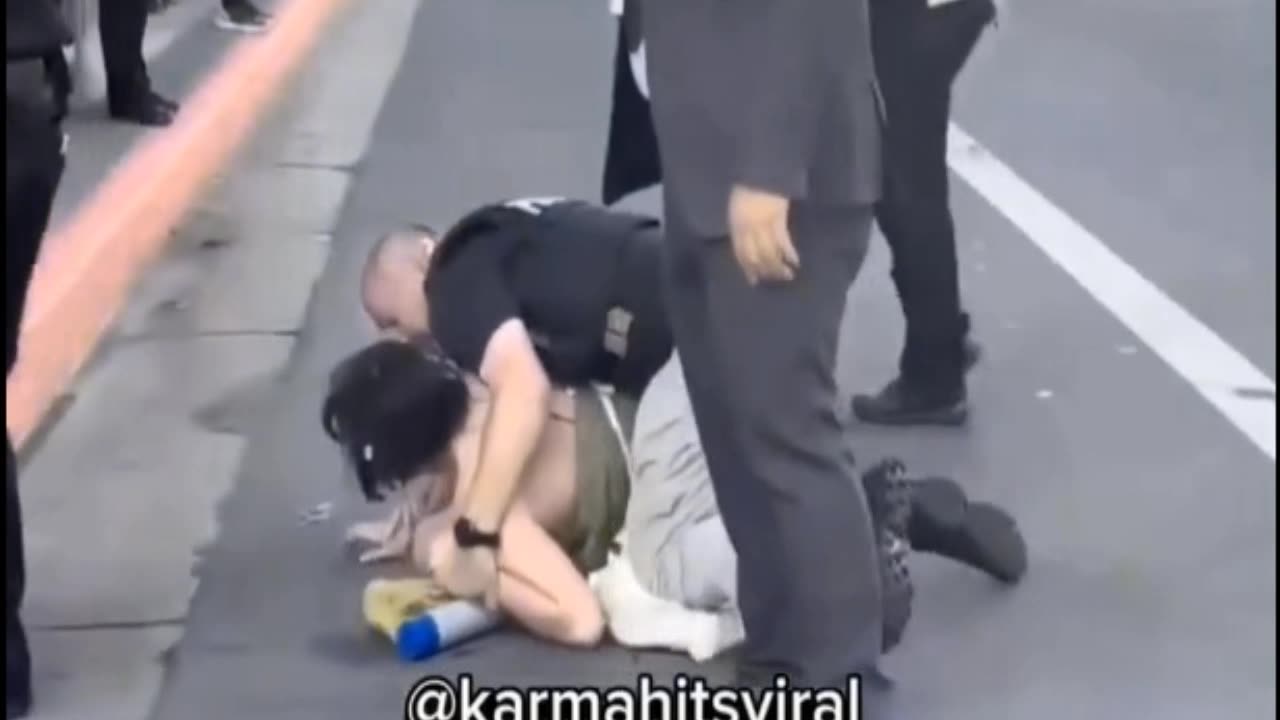 Dumb Protestor Taken Down By Police.. LMAO