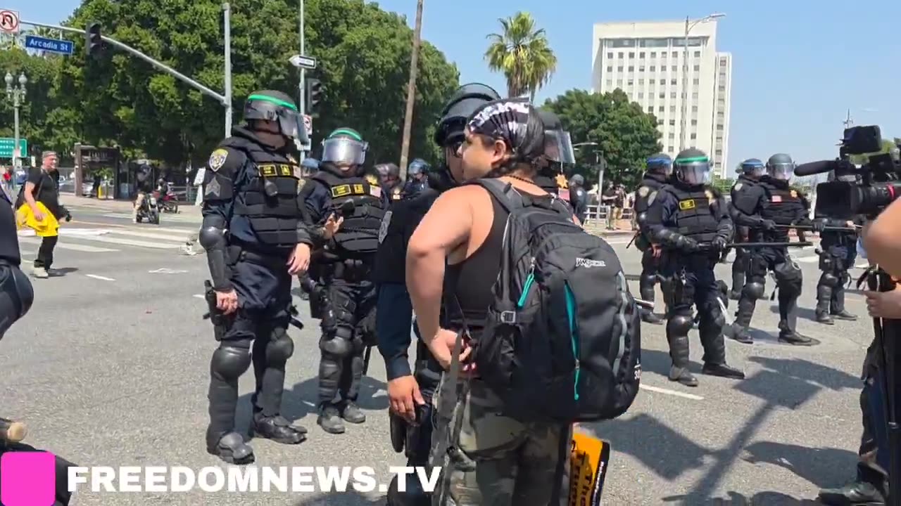 HORDES of people are flooding around National Guardsmen outside a detention