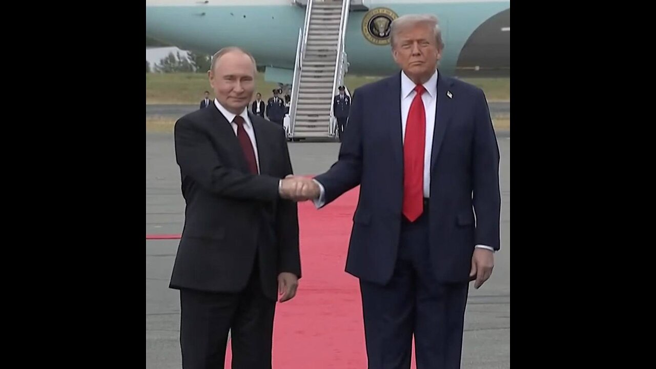 Trump and Putin meet, shake hands.