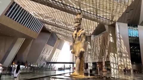 The majestic statue of Pharaoh Ramses II greets guests at Egypt's Grand Egyptian Museum.