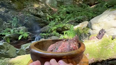 cooking potatoes with meatballs on a tile