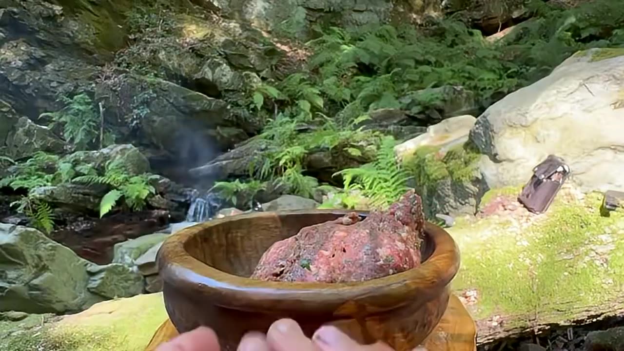 cooking potatoes with meatballs on a tile