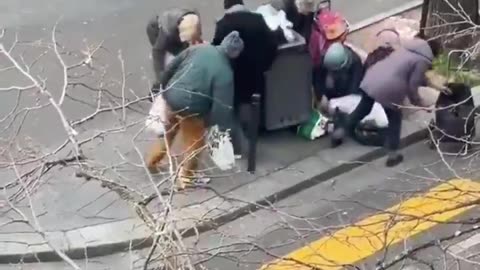 This is Paris and these are French pensioners looking for food in garbage bins