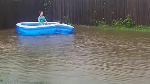 Kids' Floating Pool in Flooded Backyard