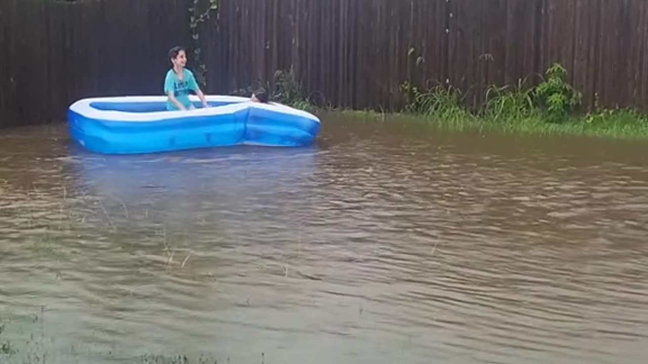 Kids' Floating Pool in Flooded Backyard