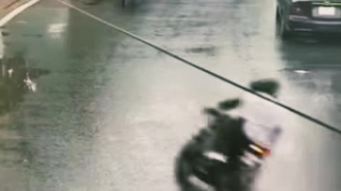 The motorcycle driver who is making a turn