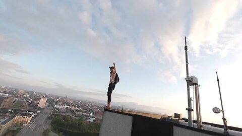 Climber scales, leap off Denmark hotel in base jump stunt