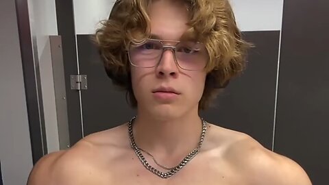 Young bodybuilder flexing muscles